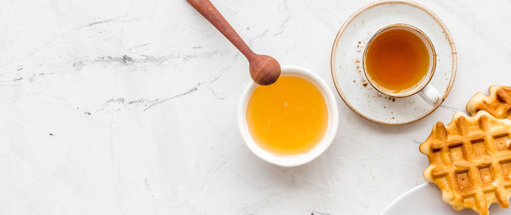 Wildflower honey, tea, and waffles for breakfast.