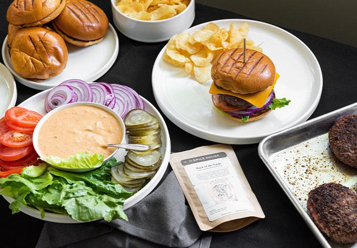 Perfectly cooked cheeseburger with lettuce, onions, tomatoes, pickles, and special hamburger sauce.